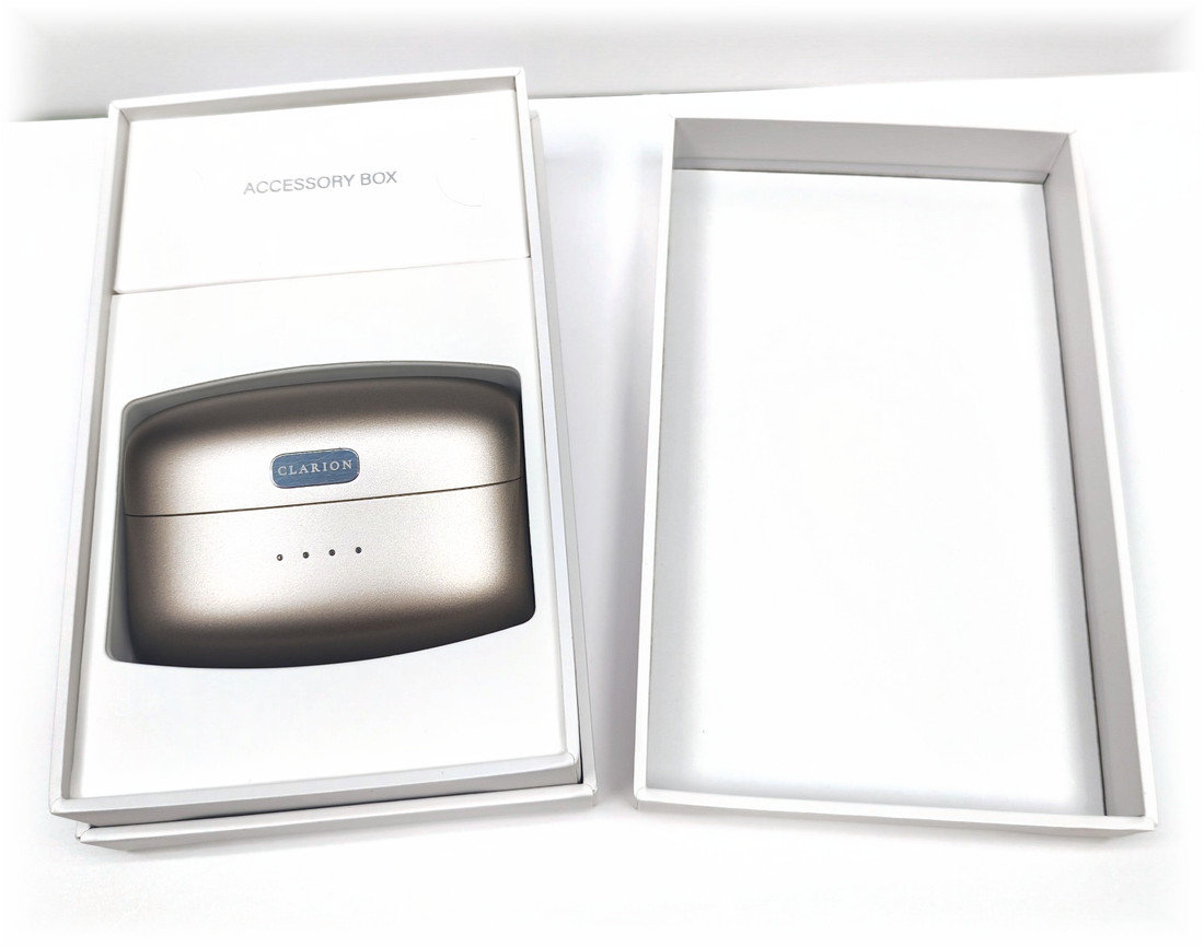 The presentation box open with the charging case seated inside it.